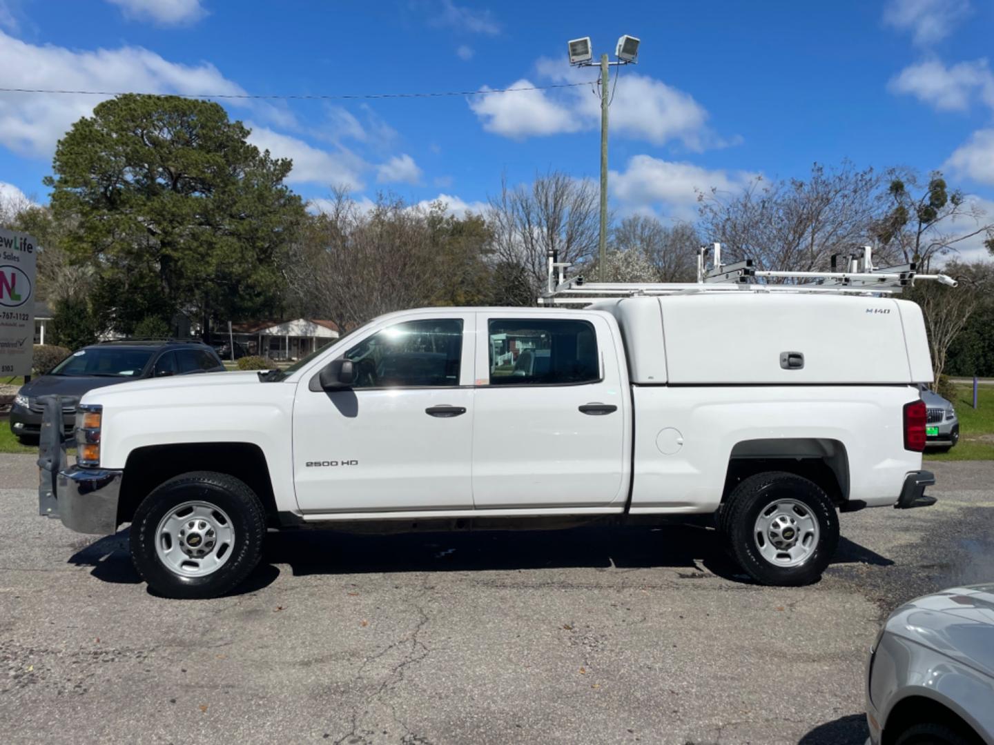 2015 WHITE CHEVROLET SILVERADO 2500H WORK TRUCK (1GC1KUEG7FF) with an 6.0L engine, Automatic transmission, located at 5103 Dorchester Rd., Charleston, SC, 29418-5607, (843) 767-1122, 36.245171, -115.228050 - Local Trade-in with Easy Clean Vinyl Interior, Backup Camera, AM/FM/AUX, Spacious Rear Seat, Power Windows, Power Locks, Power Mirrors, Utility Cab with Storage All Around, Pull Out Bed Storage, Ladder Rack, Safety Strobe Lights, Keyless Entry, Tow Package with Brake Assist, 4-Wheel Drive, Brush Gua - Photo#3